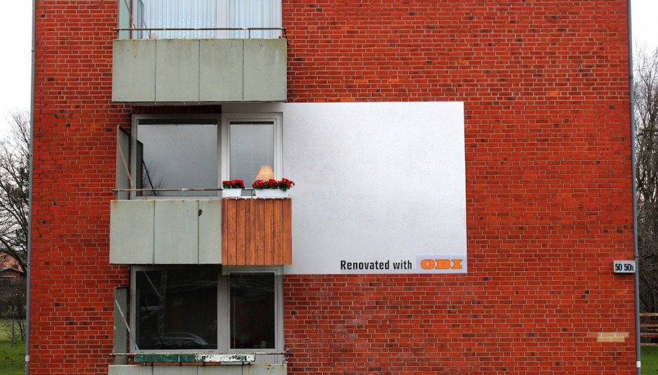 houses become billboards for diy stores in germany ads for houses